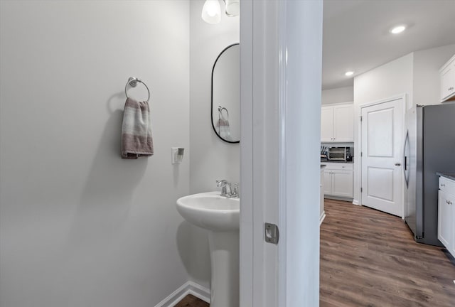 411 Bering Ln, Summerville, SC 29486 - bathroom featuring wood finished floors, recessed lighting, a sink, and baseboards