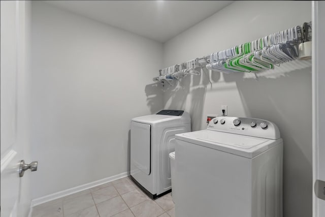 411 Bering Ln, Summerville, SC 29486 - laundry room featuring washer and dryer, light tile patterned floors, and baseboards