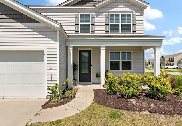 411 Bering Ln, Summerville, SC 29486 - view of front of house featuring a porch, a garage, and driveway