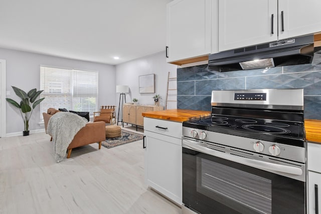 867 Colony Dr Unit F92, Charleston, SC 29407 - kitchen featuring electric range, under cabinet range hood, butcher block counters, backsplash, and white cabinets
