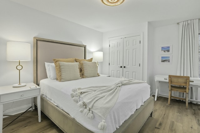 bedroom with a closet and wood finished floors