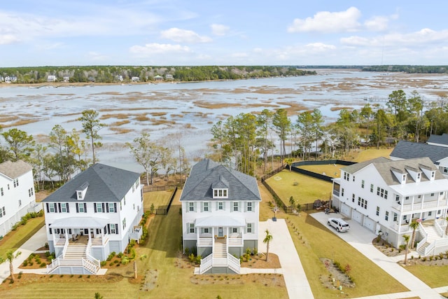 birds eye view of property featuring a residential view and a water view