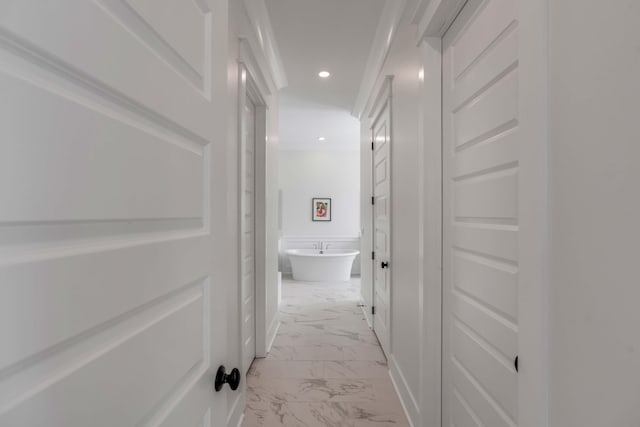 hallway featuring recessed lighting and marble finish floor