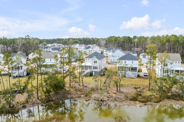 bird's eye view with a residential view and a water view