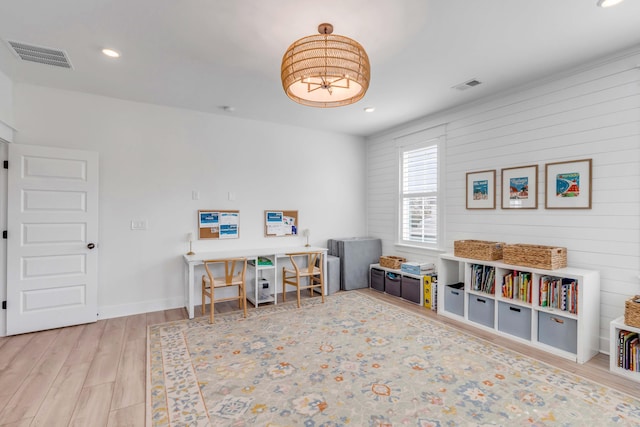 recreation room with recessed lighting, wood finished floors, and visible vents