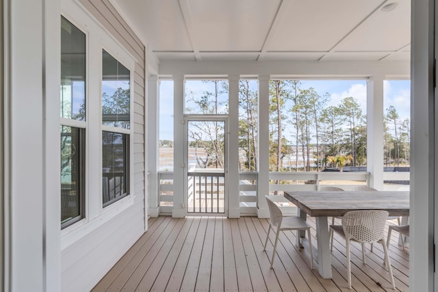 sunroom / solarium featuring plenty of natural light and a paneled ceiling