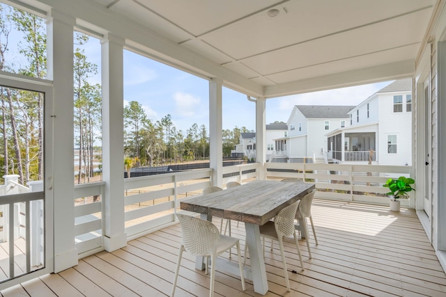 sunroom with a residential view