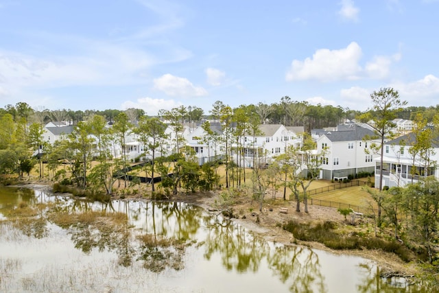 water view featuring a residential view and fence