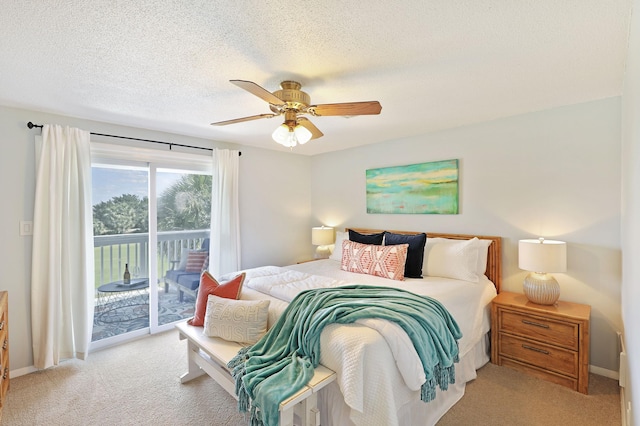 bedroom featuring light carpet, access to exterior, a textured ceiling, baseboards, and ceiling fan