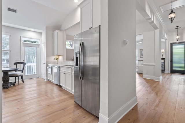 116 Cartright St, Daniel Island, SC 29492 - kitchen featuring appliances with stainless steel finishes, light countertops, light wood-style floors, white cabinets, and recessed lighting