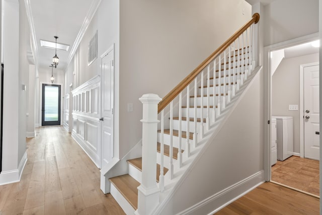116 Cartright St, Daniel Island, SC 29492 - stairs featuring wood finished floors and crown molding