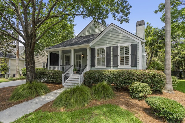 116 Cartright St, Daniel Island, SC 29492 - view of front of house with a chimney and a porch