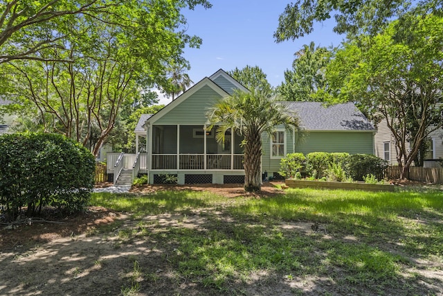 116 Cartright St, Daniel Island, SC 29492 - back of property featuring a sunroom, roof with shingles, and stairway