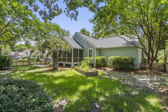 116 Cartright St, Daniel Island, SC 29492 - rear view of property featuring a sunroom and roof with shingles