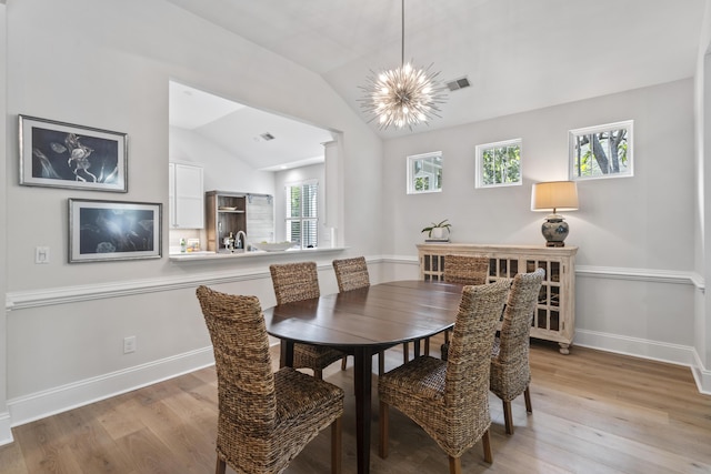 116 Cartright St, Daniel Island, SC 29492 - dining area with light wood-style flooring, a chandelier, and vaulted ceiling