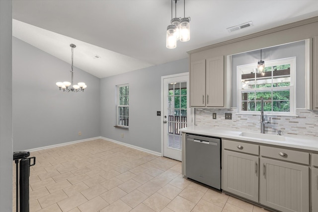 kitchen with dishwasher, a chandelier, gray cabinetry, a sink, and lofted ceiling