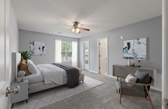 carpeted bedroom with baseboards, a ceiling fan, and a textured ceiling