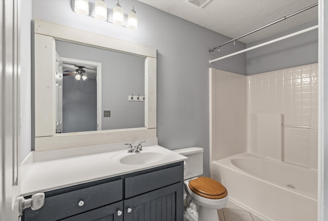 full bathroom with toilet, vanity, tile patterned flooring, a textured ceiling, and washtub / shower combination