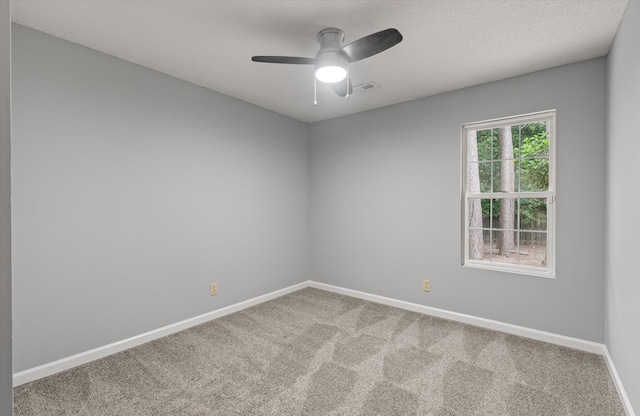 unfurnished room with carpet, baseboards, and ceiling fan