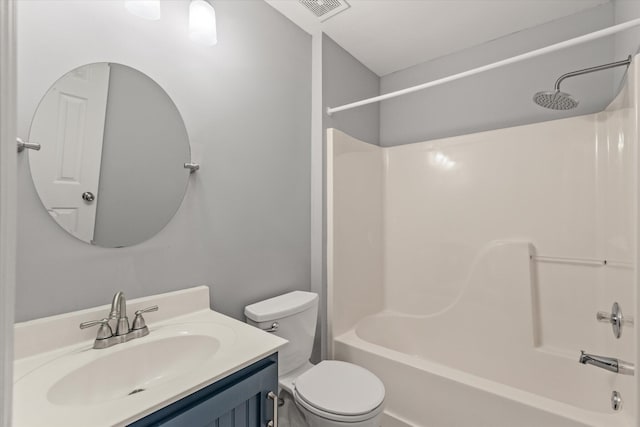 full bathroom with bathing tub / shower combination, toilet, and vanity