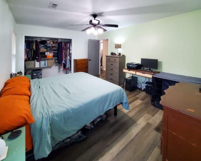 bedroom with hardwood / wood-style flooring and ceiling fan