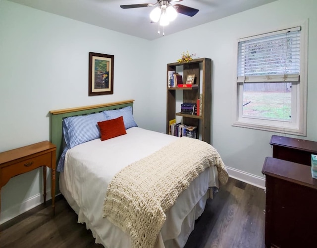 bedroom with ceiling fan and dark wood-type flooring