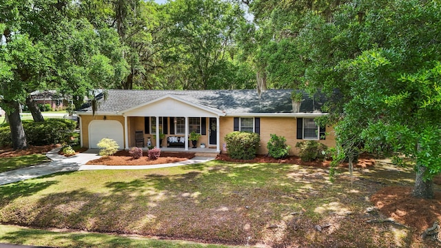 520 Yale Dr, Charleston, SC 29412 - ranch-style house with a porch, an attached garage, driveway, a shingled roof, and a front yard