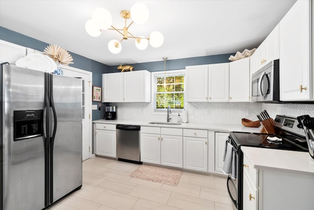 520 Yale Dr, Charleston, SC 29412 - kitchen featuring stainless steel appliances, a sink, decorative backsplash, light countertops, and a chandelier