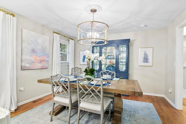 520 Yale Dr, Charleston, SC 29412 - dining room with a chandelier, wood finished floors, and baseboards