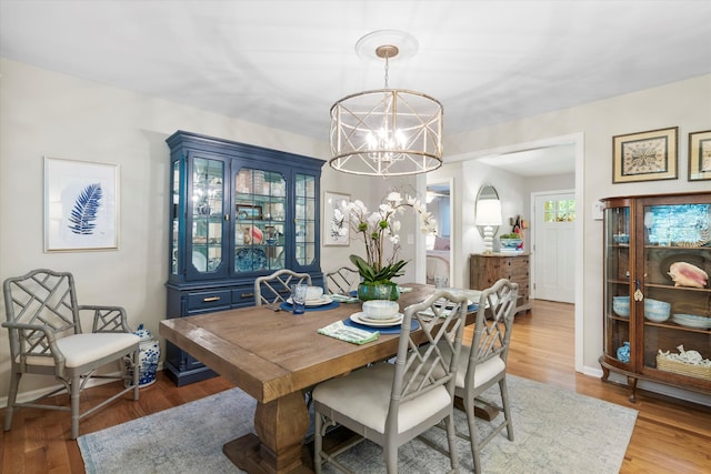 520 Yale Dr, Charleston, SC 29412 - dining space featuring a chandelier, wood finished floors, and baseboards