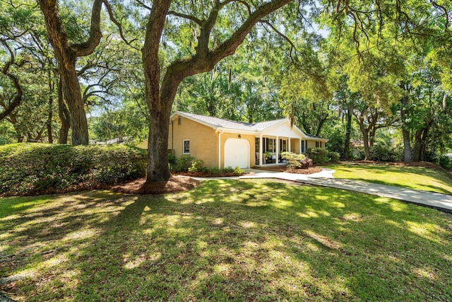 520 Yale Dr, Charleston, SC 29412 - ranch-style home featuring a garage, a front lawn, driveway, and stucco siding