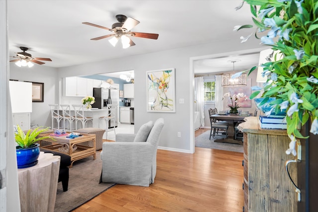 520 Yale Dr, Charleston, SC 29412 - living room with a ceiling fan, light wood-style flooring, a chandelier, and baseboards