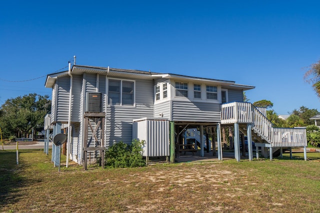 rear view of house with a yard