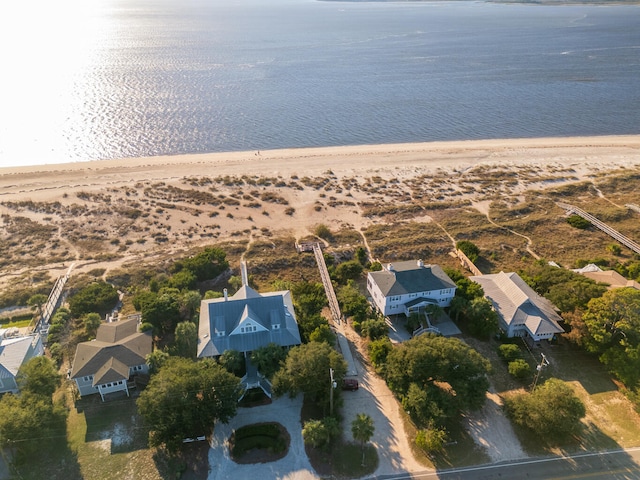 drone / aerial view with a water view and a view of the beach