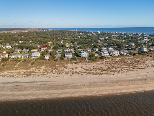 bird's eye view featuring a water view and a view of the beach