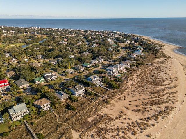 aerial view with a water view and a beach view