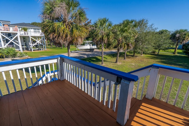 wooden terrace with a yard