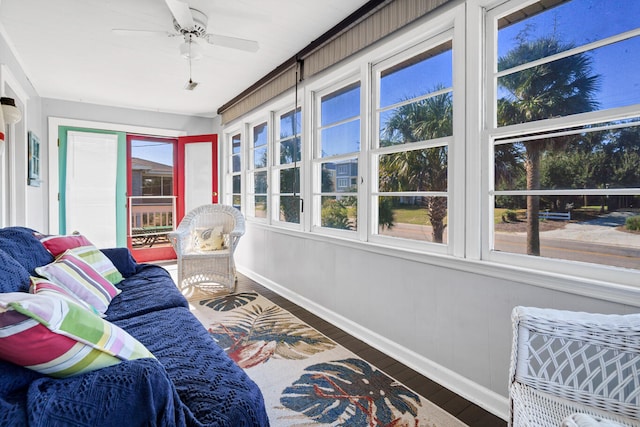 sunroom with plenty of natural light and ceiling fan