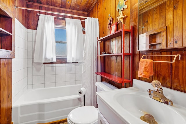 full bathroom featuring vanity, wooden ceiling, wooden walls, toilet, and shower / bathtub combination with curtain