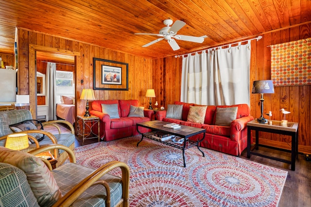 living room featuring hardwood / wood-style flooring, ceiling fan, wooden ceiling, and wood walls