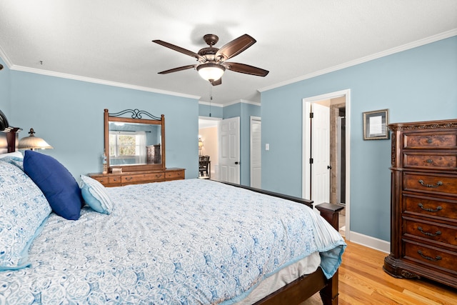 bedroom with light hardwood / wood-style floors, ornamental molding, and ceiling fan