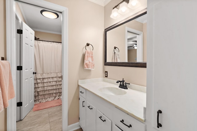 bathroom with vanity and ornamental molding