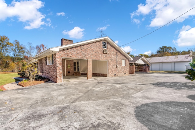 back of property featuring a garage