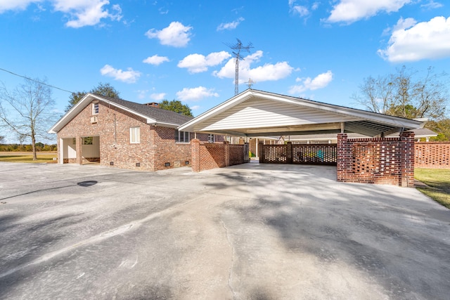 view of side of property featuring a carport