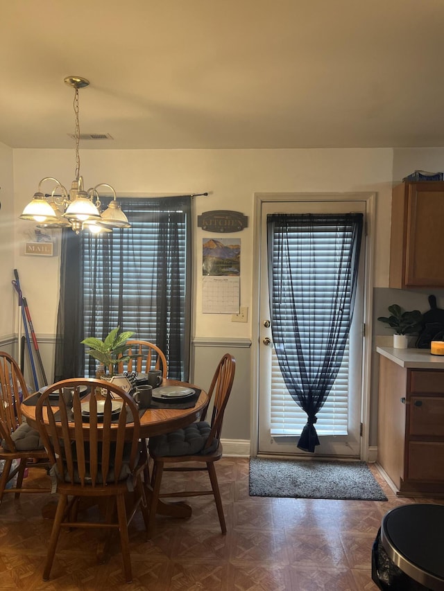 527 Travelers Blvd, Summerville, SC 29485 - dining area with a chandelier and baseboards