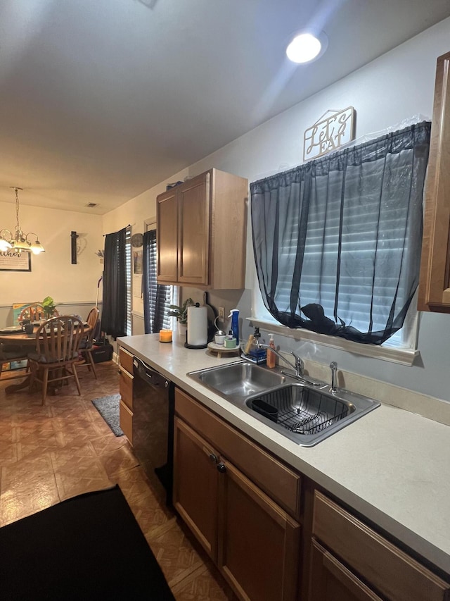 527 Travelers Blvd, Summerville, SC 29485 - kitchen with black dishwasher, a sink, light countertops, and a chandelier