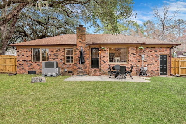 back of house with crawl space, a patio area, cooling unit, and brick siding