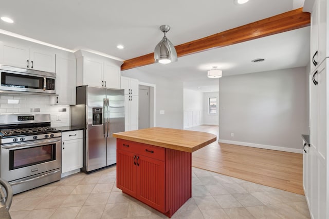 kitchen with backsplash, beamed ceiling, stainless steel appliances, recessed lighting, and butcher block countertops