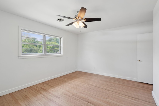 unfurnished room with visible vents, baseboards, ceiling fan, and light wood-type flooring