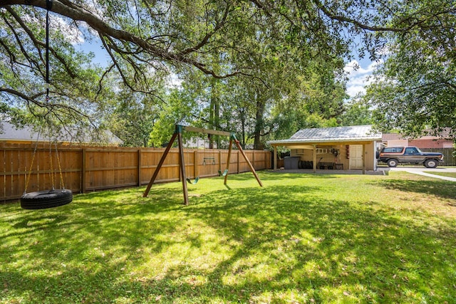 view of yard featuring a fenced backyard and a playground